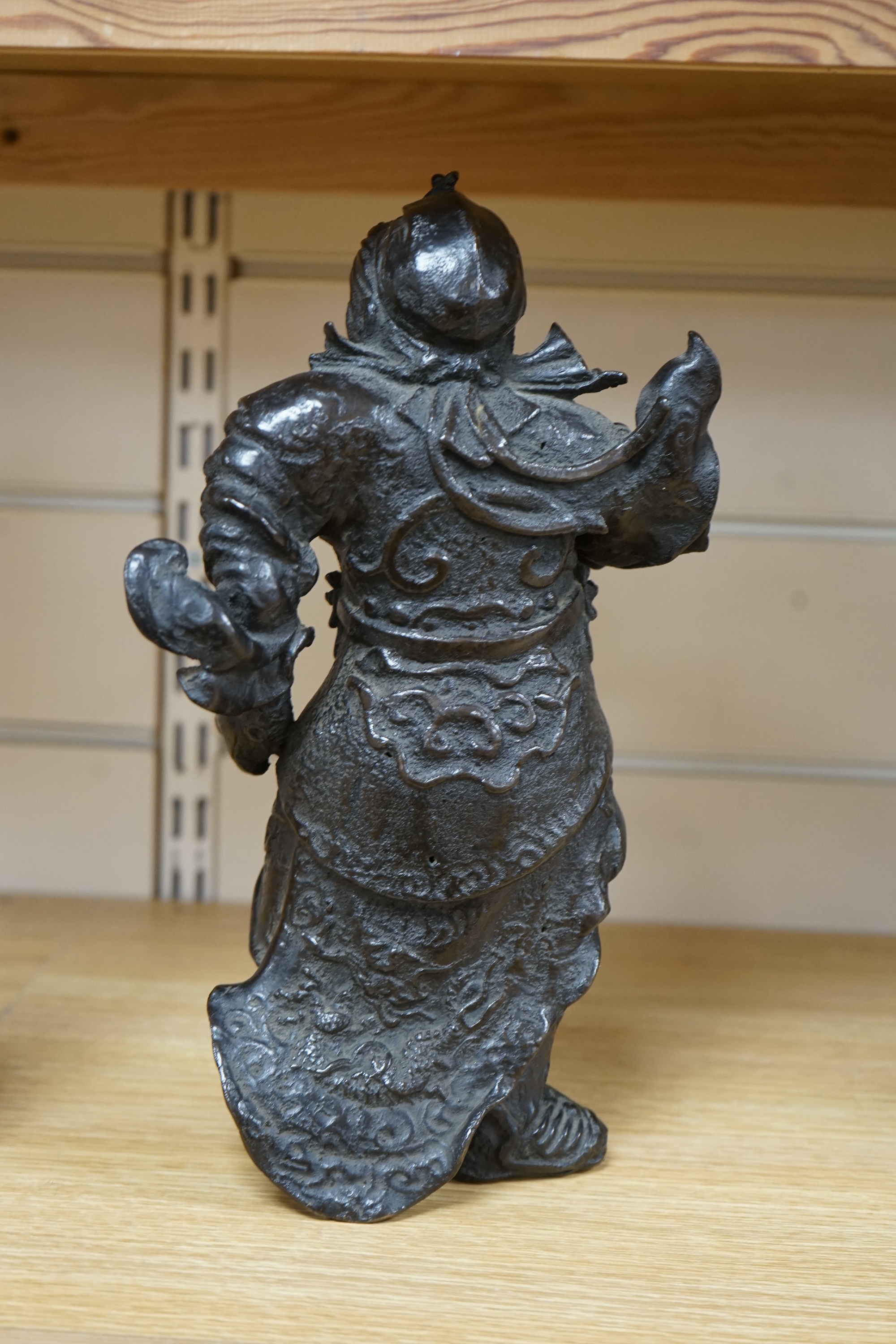 A 20th century Chinese bronze figure of Guan Yu, 29cm. Condition - fair to good